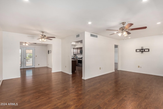 unfurnished living room with dark wood-type flooring