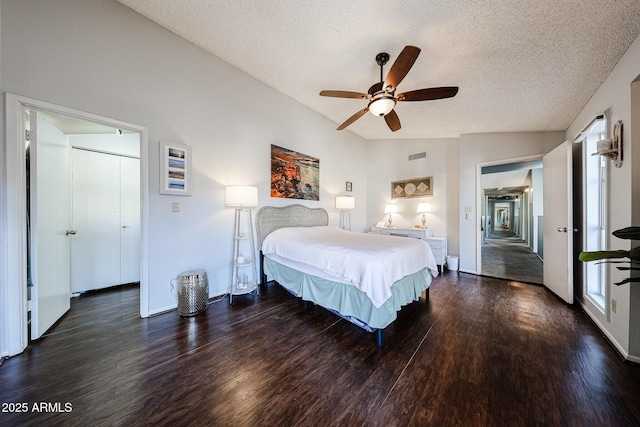 6533 N 10th Pl, Phoenix, AZ 85014 - bedroom with dark wood-style flooring, a textured ceiling, baseboards, and a ceiling fan