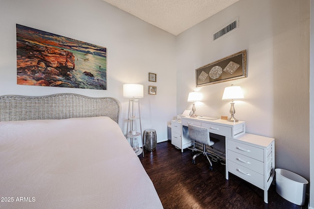 6533 N 10th Pl, Phoenix, AZ 85014 - bedroom with dark wood-style floors, an office area, a textured ceiling, baseboards, and lofted ceiling