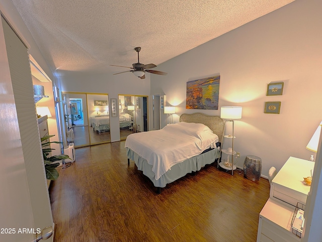6533 N 10th Pl, Phoenix, AZ 85014 - bedroom featuring a textured ceiling, wood finished floors, lofted ceiling, ceiling fan, and two closets