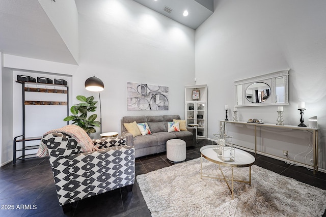 6533 N 10th Pl, Phoenix, AZ 85014 - living area with a high ceiling, baseboards, and dark tile patterned flooring