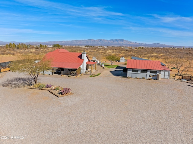 drone / aerial view featuring a mountain view