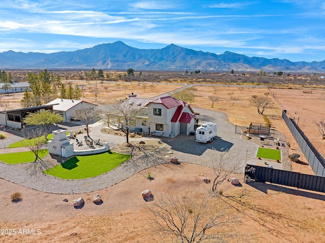 birds eye view of property featuring a mountain view