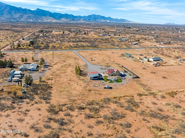 birds eye view of property with a mountain view