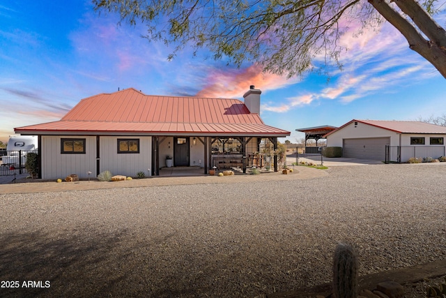 view of front facade with a porch and a garage