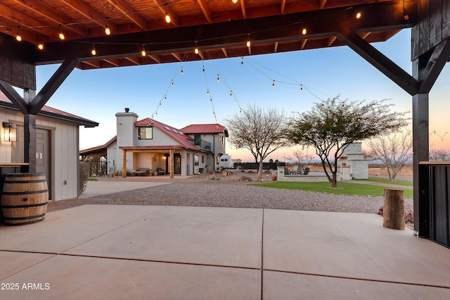 view of patio terrace at dusk