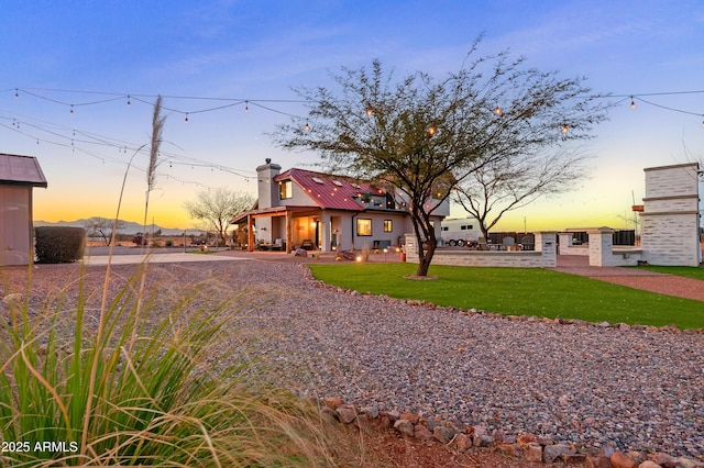 view of front of property with a yard