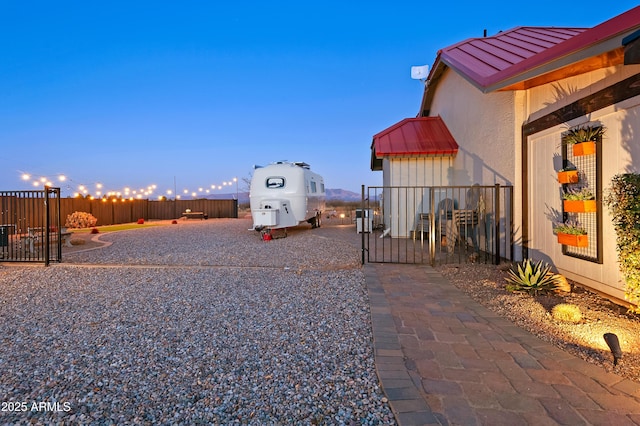 view of yard at dusk