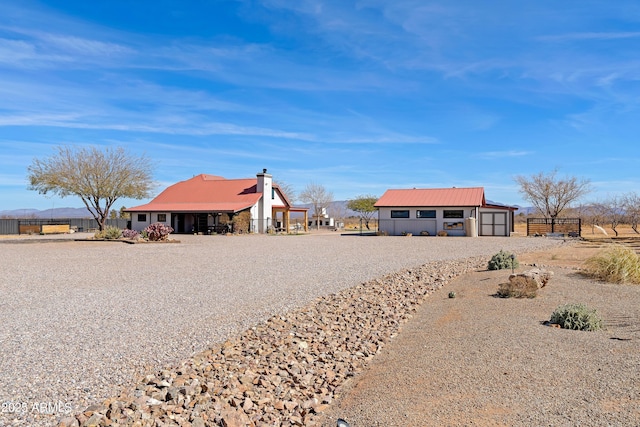 exterior space with an outbuilding and a garage