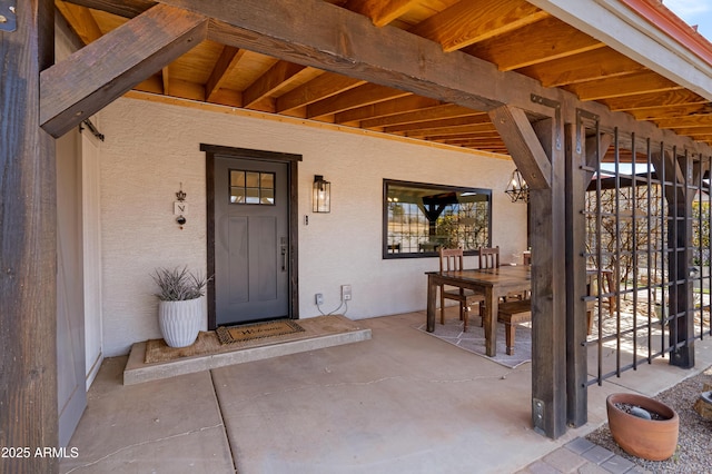 doorway to property featuring a patio area