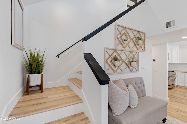 staircase featuring hardwood / wood-style floors