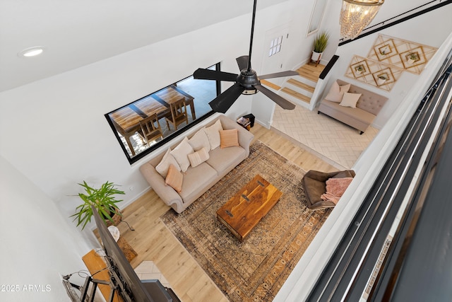 living room with hardwood / wood-style floors and ceiling fan