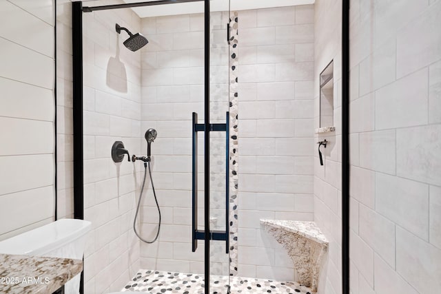 bathroom featuring an enclosed shower