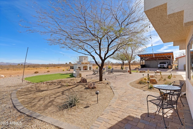 exterior space with an outdoor fireplace