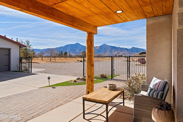 view of patio / terrace featuring a mountain view