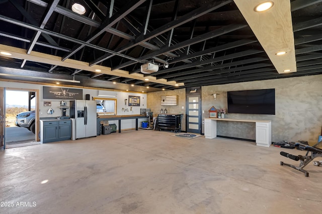 garage with stainless steel refrigerator with ice dispenser