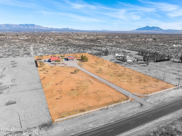 drone / aerial view featuring a mountain view