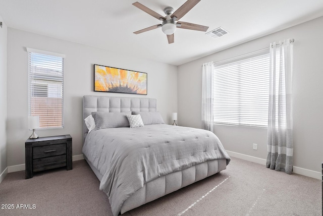 bedroom featuring carpet flooring, a ceiling fan, baseboards, and visible vents
