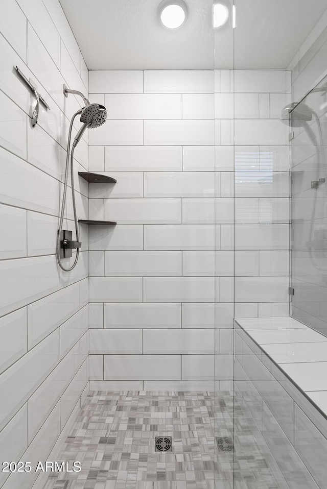 full bath with a shower stall