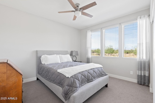 bedroom with baseboards, ceiling fan, and carpet floors