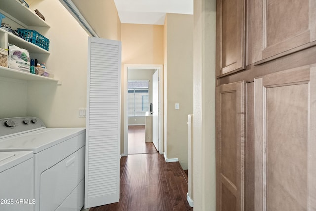 washroom featuring dark hardwood / wood-style flooring and washing machine and clothes dryer