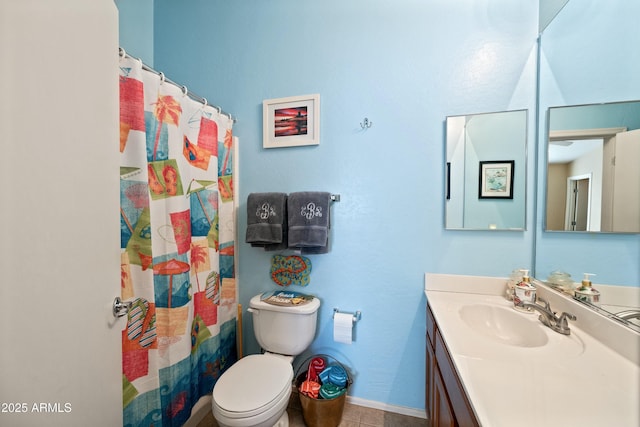 bathroom featuring vanity, toilet, walk in shower, and tile patterned flooring