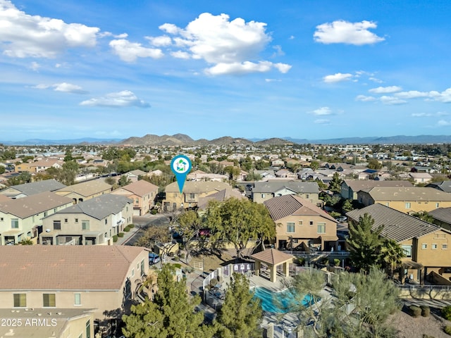 birds eye view of property with a mountain view