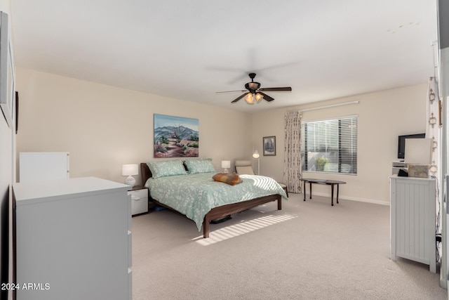 bedroom with light carpet and ceiling fan