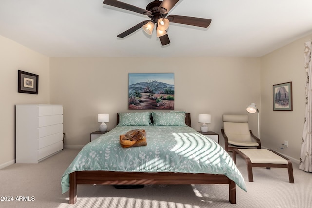 bedroom featuring ceiling fan and light carpet