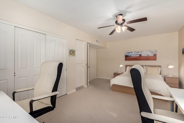 bedroom with light carpet, a closet, and ceiling fan