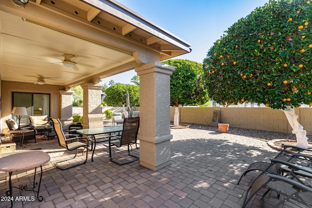 view of patio featuring outdoor lounge area and ceiling fan