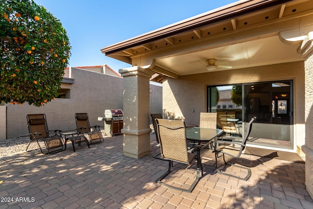 view of patio / terrace with ceiling fan and a grill