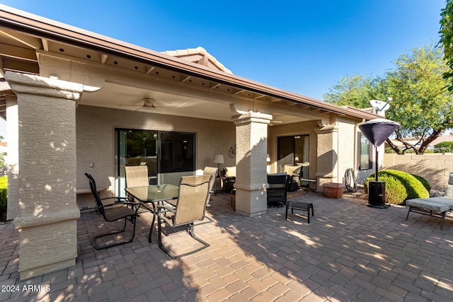 view of patio featuring ceiling fan