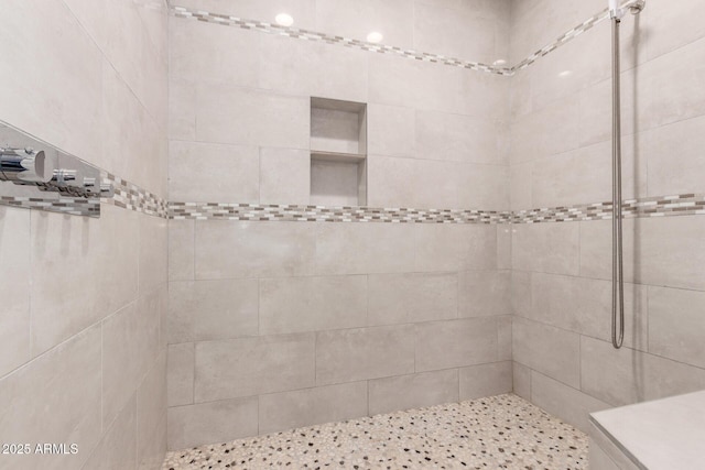 bathroom featuring tiled shower