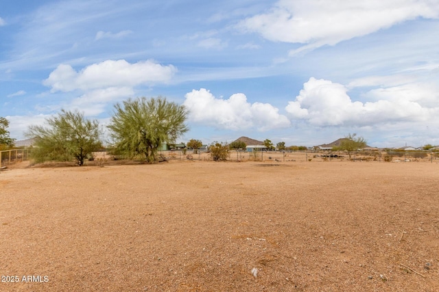 view of yard with a rural view