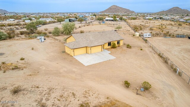 birds eye view of property with a mountain view