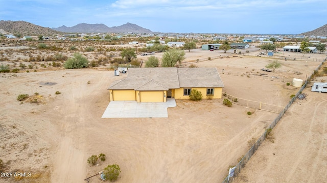 birds eye view of property featuring a mountain view