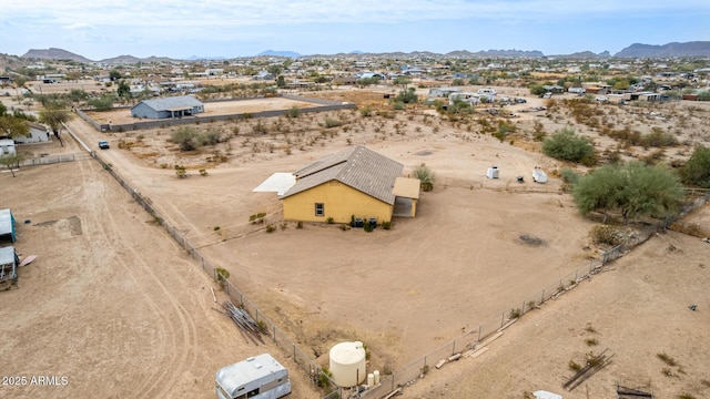 birds eye view of property featuring a mountain view