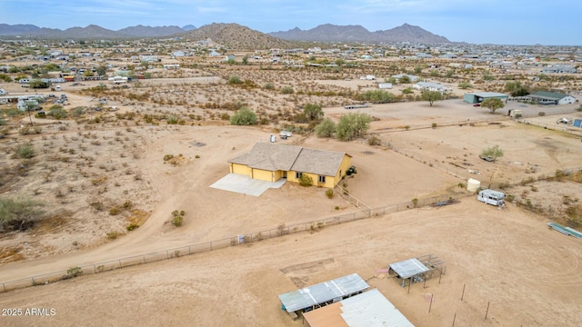 birds eye view of property with a mountain view