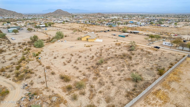 birds eye view of property featuring a mountain view