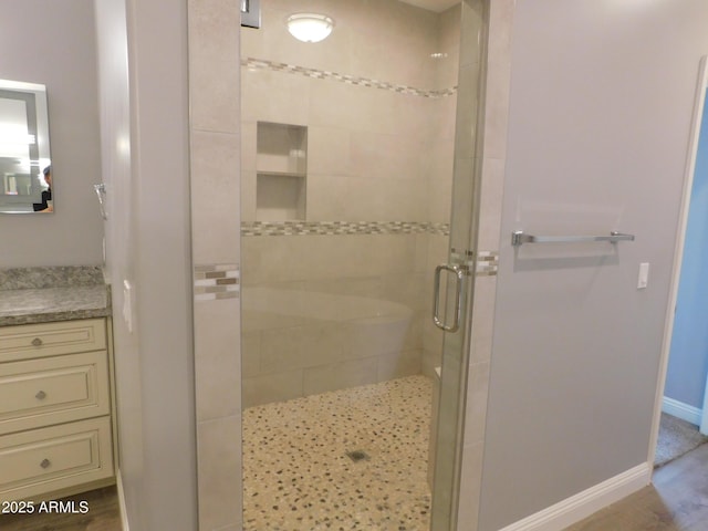 bathroom with vanity and an enclosed shower