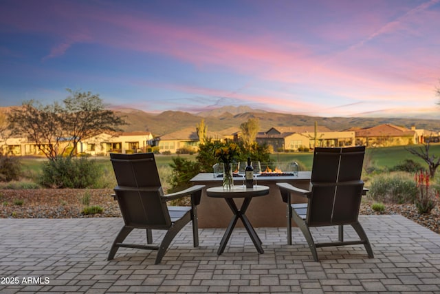 patio terrace at dusk with a mountain view