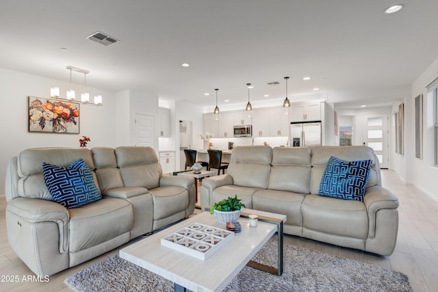 living room with a chandelier