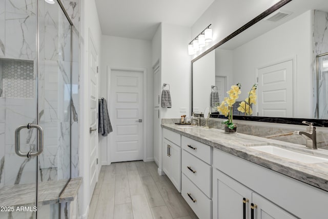 bathroom featuring vanity and walk in shower