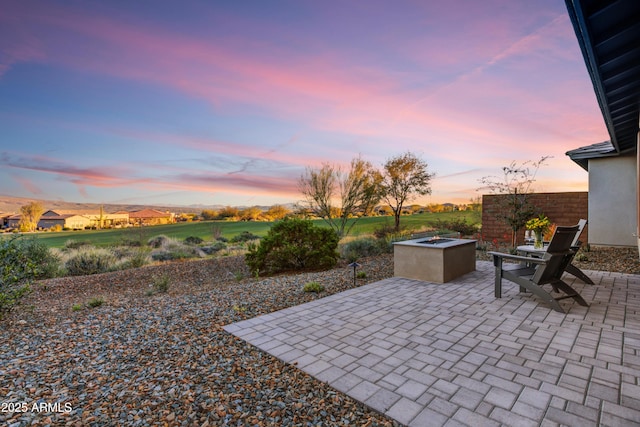 patio terrace at dusk with an outdoor fire pit