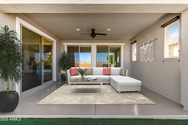 view of patio featuring ceiling fan and an outdoor living space