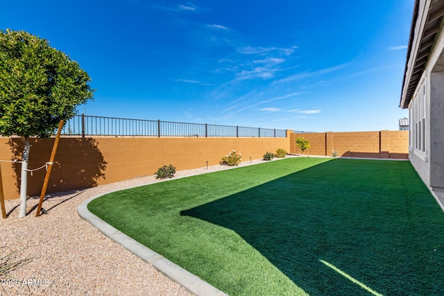 view of yard featuring a fenced backyard