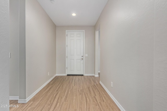 interior space with light wood-type flooring and baseboards