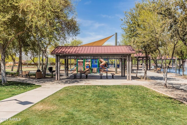 view of community with playground community and a lawn