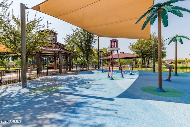 community jungle gym with a gazebo and fence